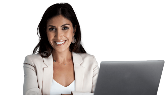Professional woman smiling with laptop on desk