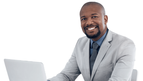 Professional man in tie smiling with laptop on desk